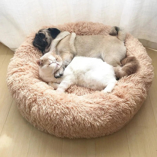 Soft, washable Calming Donut Pet Bed by Mufaal.com for dogs and cats, designed to reduce anxiety with plush, cozy cushioning.