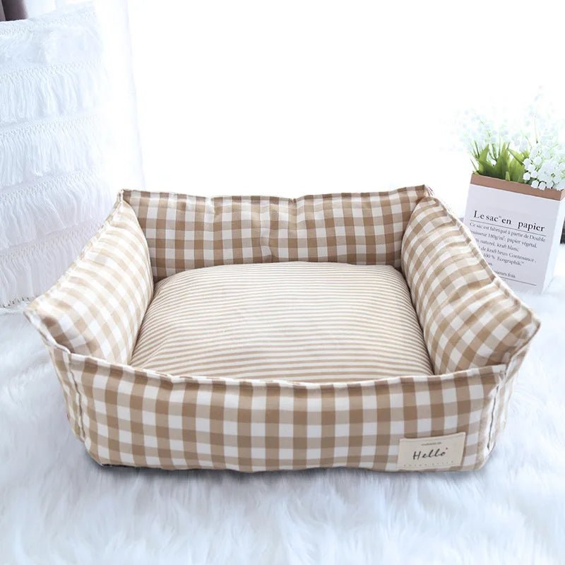 Soft plush raised pet bed for dogs and cats with head support, washable and comfortable for cozy rest.