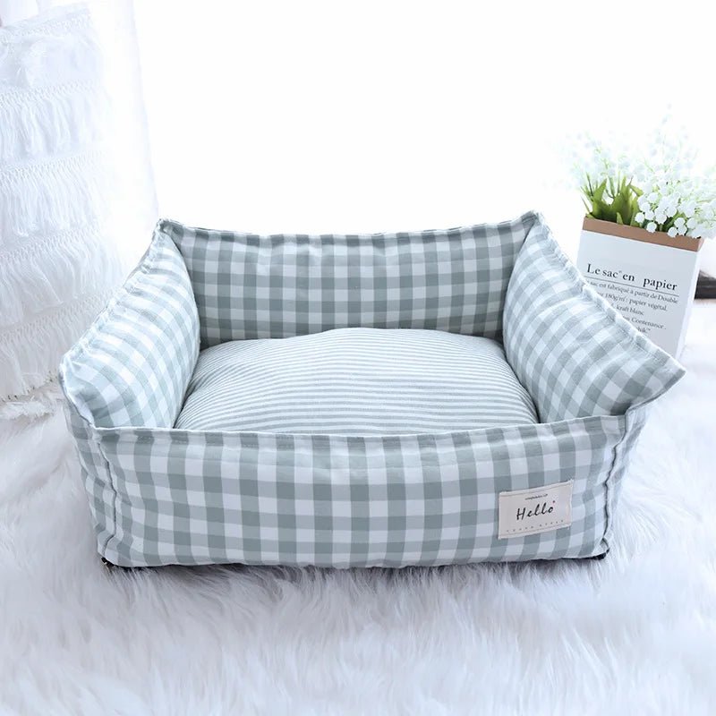 Soft plush raised pet bed with head support for dogs and cats, washable and cozy for comfortable sleeping.