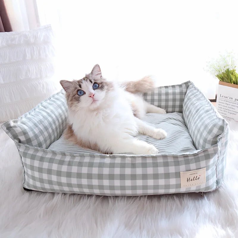 Cozy raised pet bed with soft plush fabric and supportive headrest for dogs and cats, washable for easy cleaning.