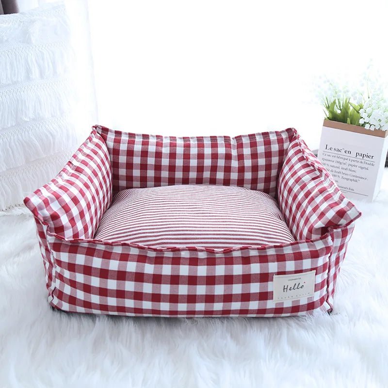 Soft plush raised pet bed for dogs and cats with head support, washable and comfortable for cozy resting.