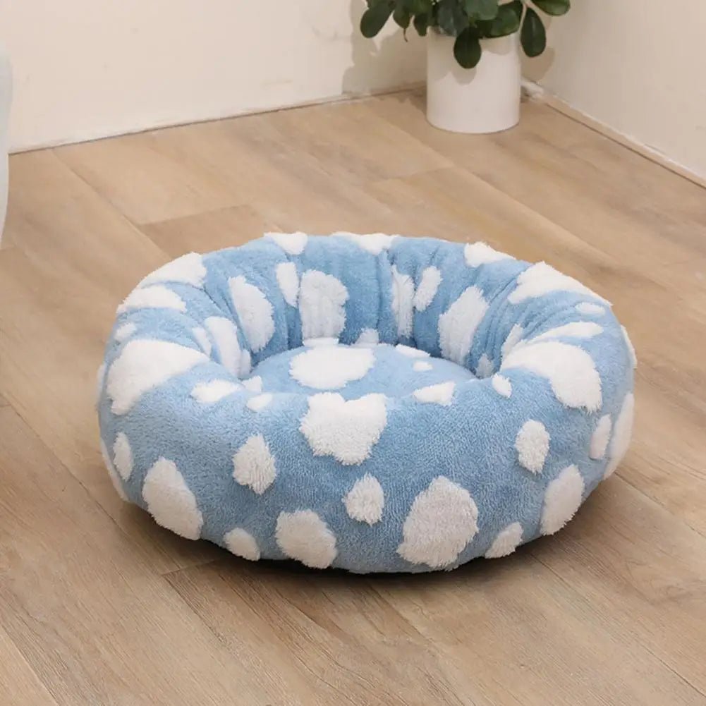 Soft plush pet nest bed with raised edges for dogs and cats, providing comfort and support for restful sleep.