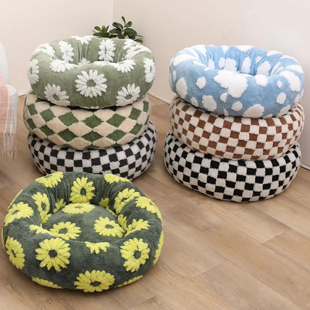 Soft plush pet nest bed with raised edges for dogs and cats, offering comfort and support for restful sleep.