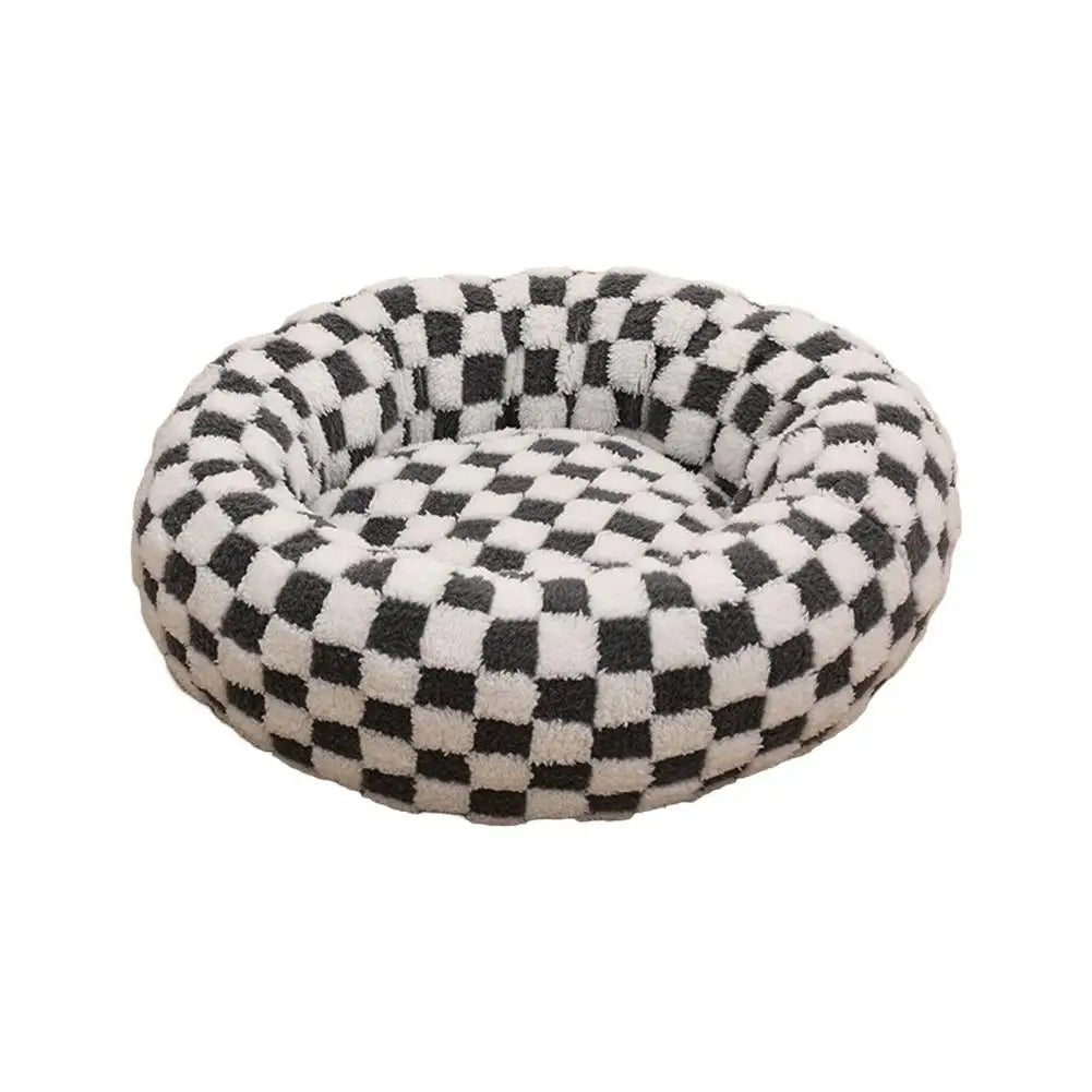 Soft plush pet nest bed with raised edges for dogs and cats, providing comfort and support for restful sleep.