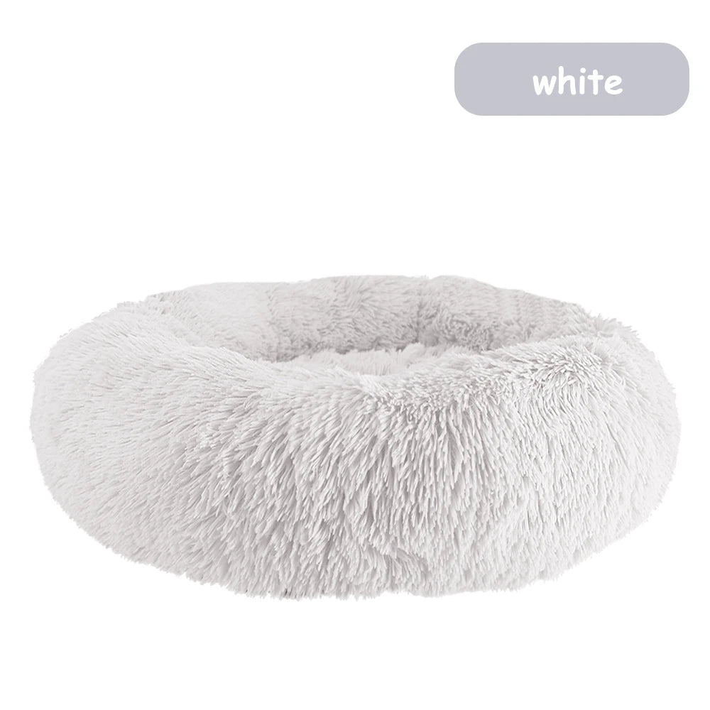 Ultra-soft donut pet bed by Mufaal.com with plush material and raised edges, ideal for calming dogs and cats.