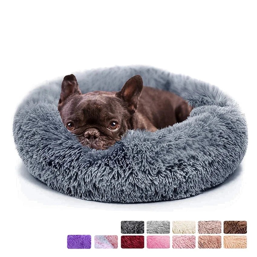 Ultra-soft donut pet bed with plush material and raised edges, ideal for dogs and cats seeking cozy, calming comfort.