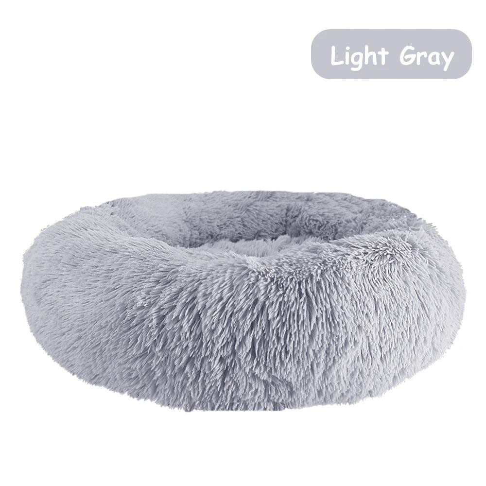 Ultra soft donut pet bed by Mufaal with plush material and raised edges, ideal for dogs and cats to rest comfortably.