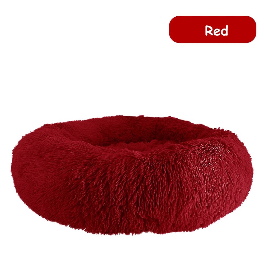 Ultra soft donut pet bed with plush fabric and raised edges, designed for dogs and cats to provide comfort and relaxation.
