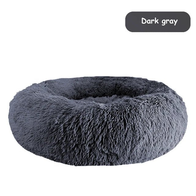 Ultra soft donut pet bed by Mufaal.com featuring plush material and raised edges for dogs and cats' comfort.