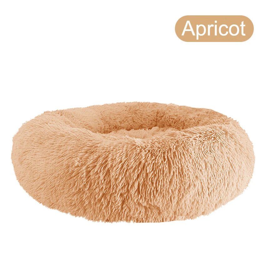 Ultra-soft donut pet bed by Mufaal.com with plush material and raised edges, ideal for calming dogs and cats.