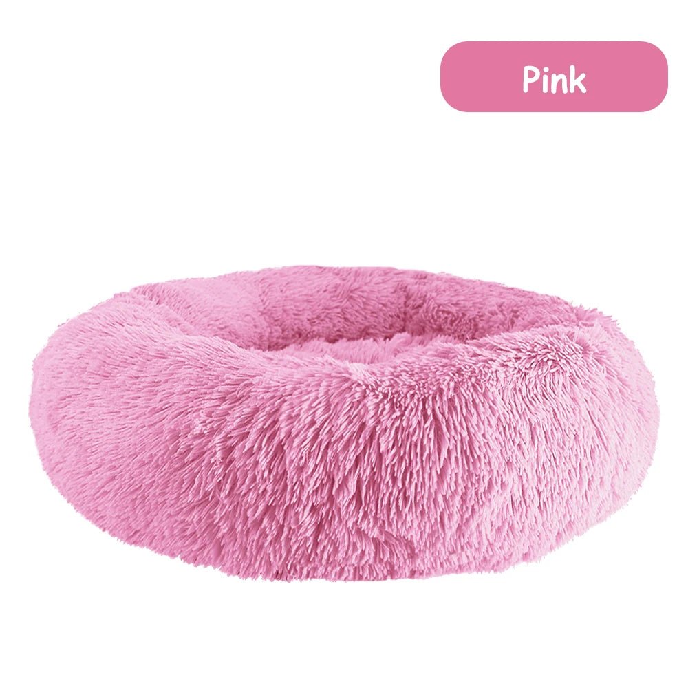 Ultra-soft donut pet bed with plush fabric and raised edges, ideal for dogs and cats seeking comfort and calming support.
