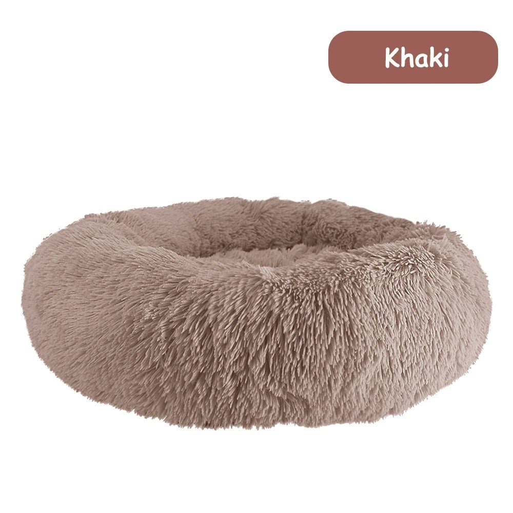 Ultra-soft donut pet bed by Mufaal with plush fabric, raised edges, and calming design for dogs and cats.